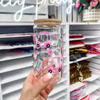 16 oz glass can featuring a golf themed UV DTF transfer with pink golf cart, flowers, and golf bag, showcasing a durable waterproof custom UV sticker wrap