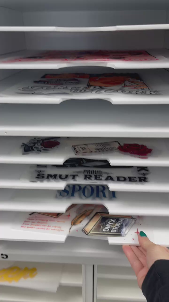 Video showing a custom DTF transfer being selected, heat pressed onto a t-shirt, and revealed as a vibrant finished apparel design.