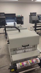 Printing custom DTF gang sheets using professional Direct to Film printing equipment.